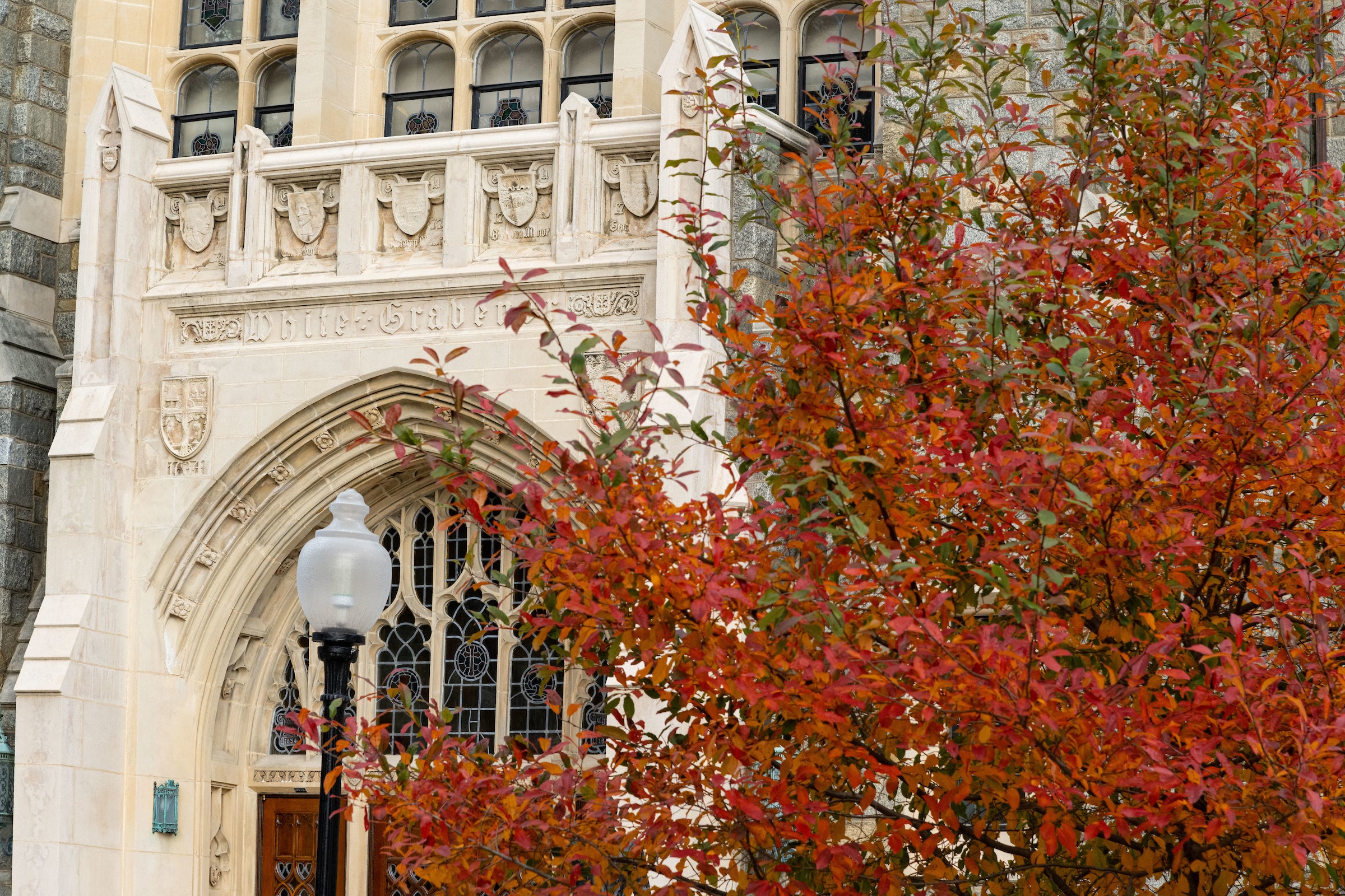 Image of White- Gravenor Hall with fall foliage in the foreground